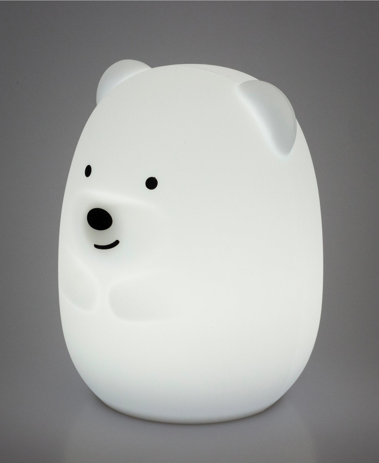 White bear-shaped night light on a gray background