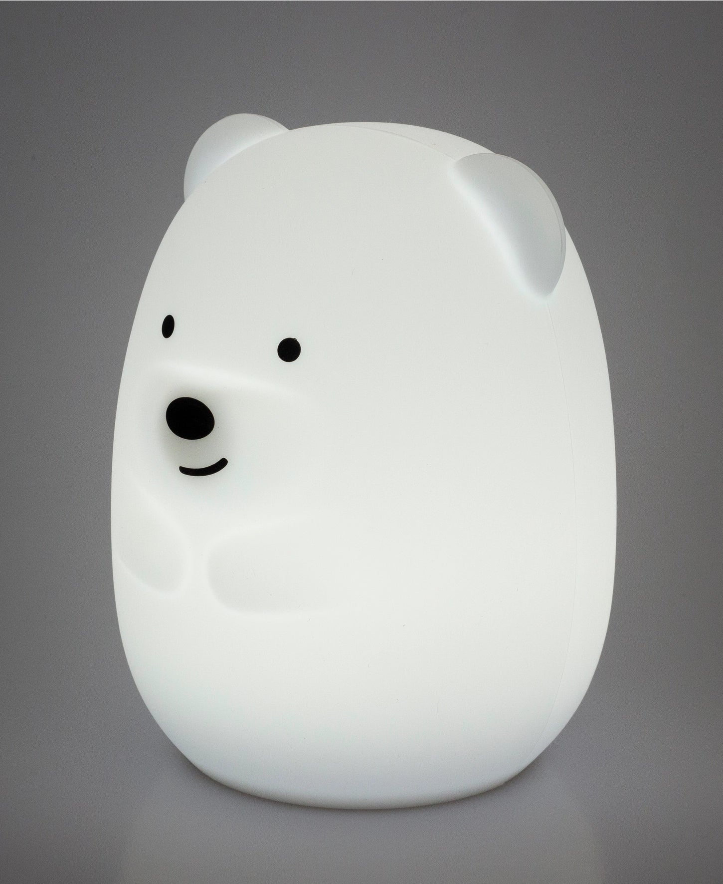 White bear-shaped night light on a gray background