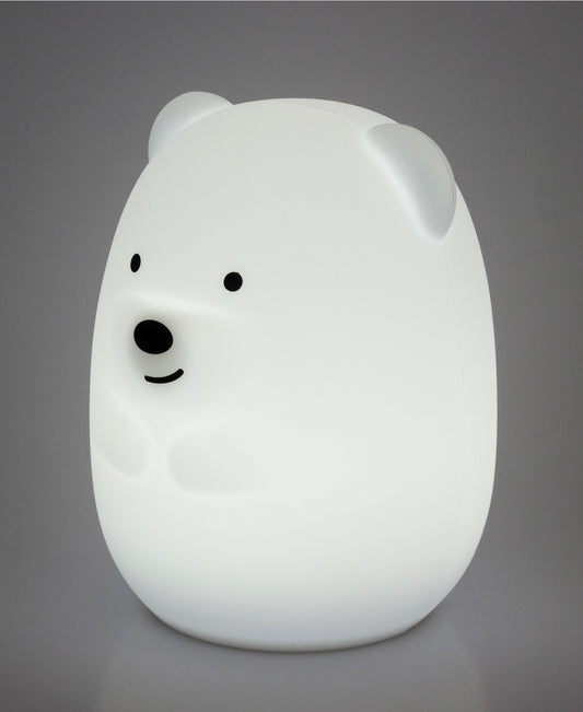 White bear-shaped night light on a gray background