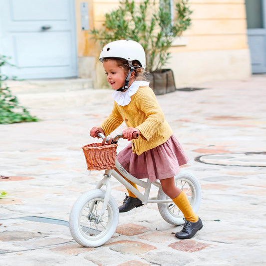 Vintage Style Beige Balance Bike For Children and Its Matching Helmet